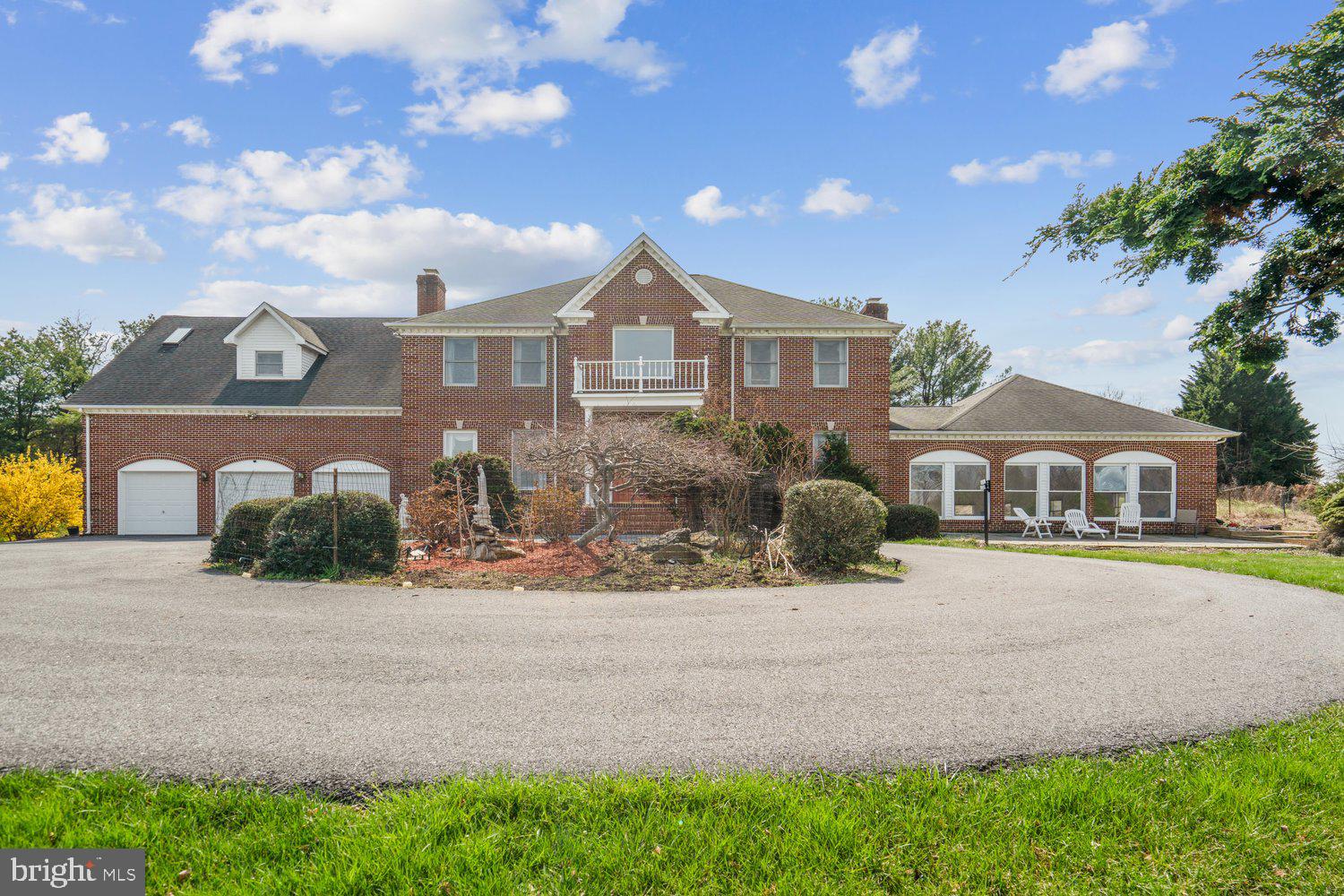 2950 Hobbs Road Glenwood, MD 21738 - Photo 7 of 82 a front view of a house with a yard and garage