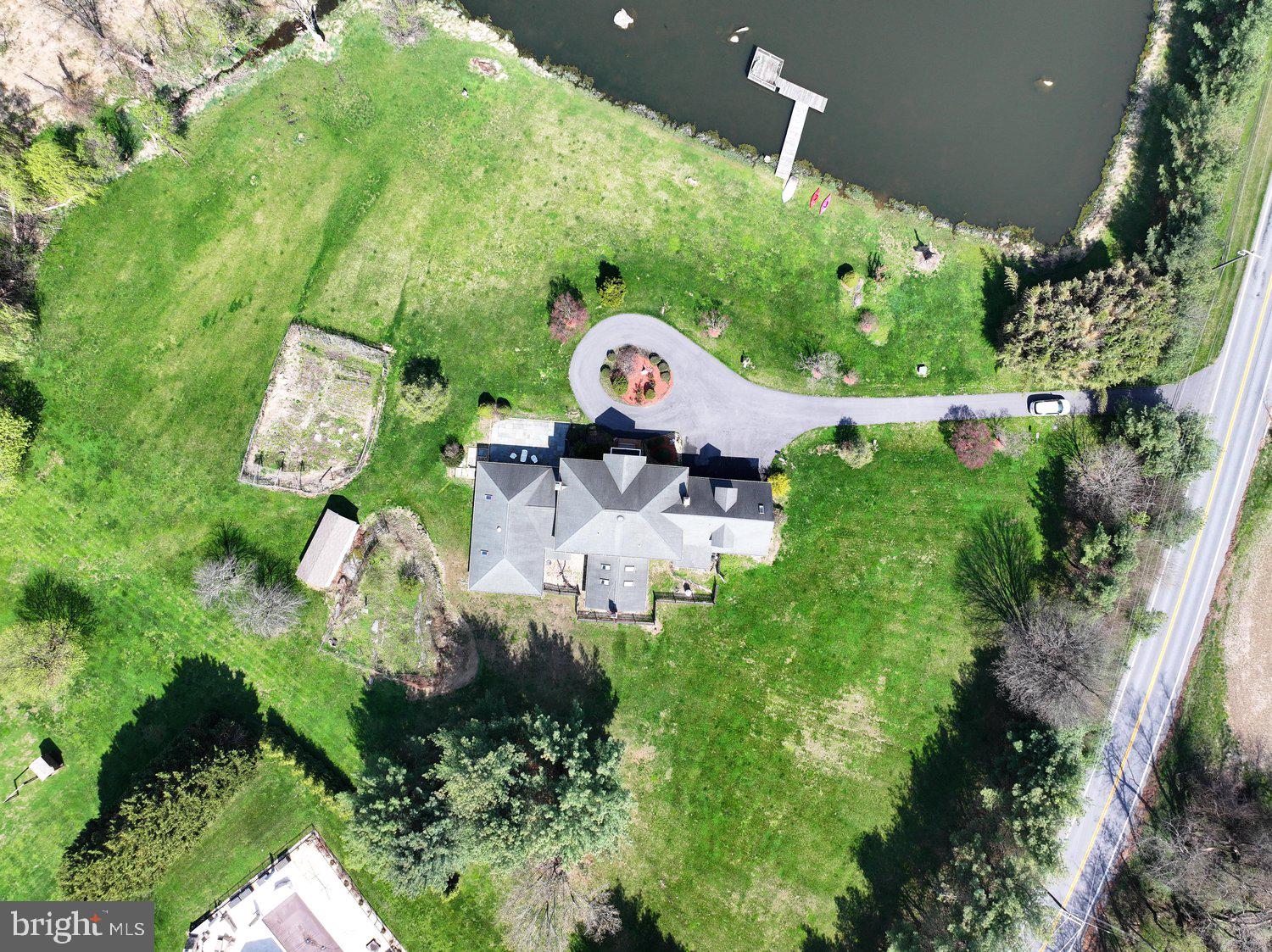 2950 Hobbs Road Glenwood, MD 21738 - Photo 73 of 82 an aerial view of a house with a yard and outdoor seating