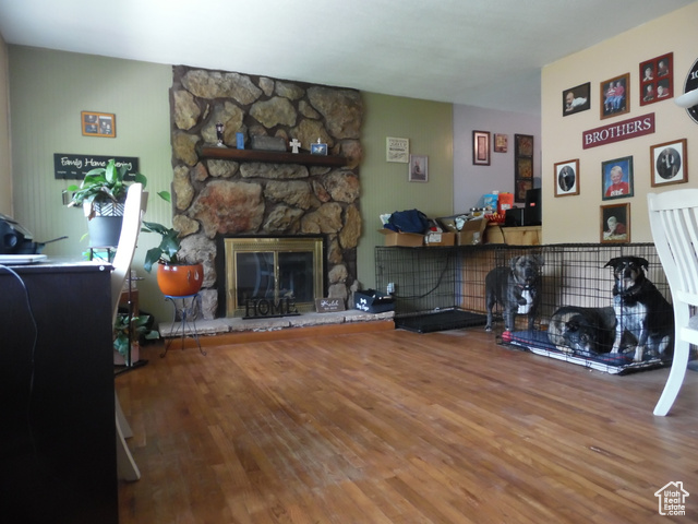 477 Grand Circle Moab, UT 84532 - Photo 5 of 22 Living room featuring wood finished floors and a fireplace
