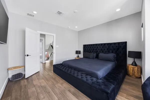 a bedroom with bed and window