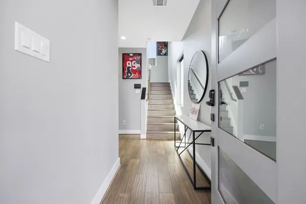 a view of entryway with wooden floor