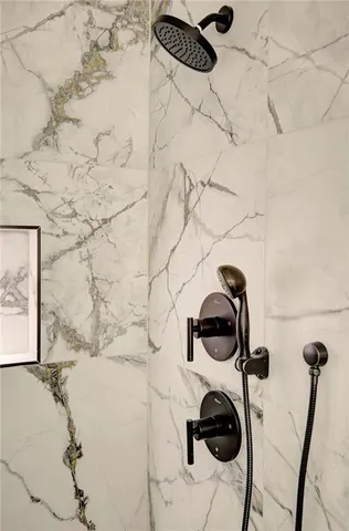 a bedroom with a large bed and a large window