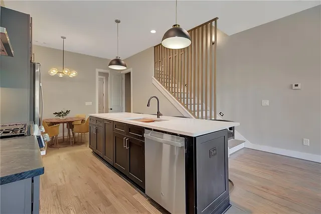 a kitchen with a sink and a refrigerator