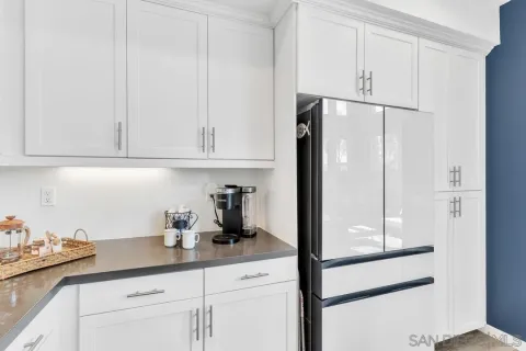 a kitchen with appliances and cabinets
