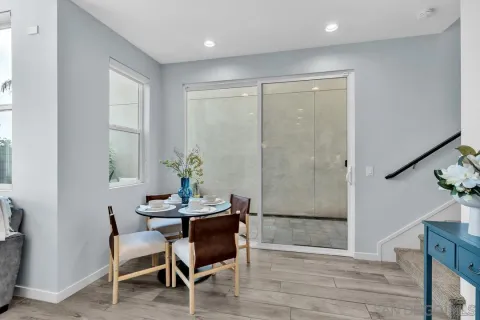 a dining room with furniture and window