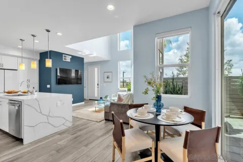 a view of a dining room with furniture and window