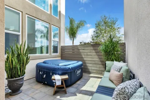a living room with furniture and a potted plant