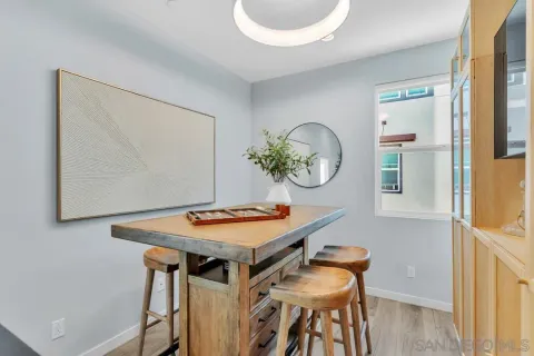 a dining room with furniture and window