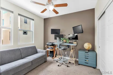 a view of a livingroom with furniture and a window