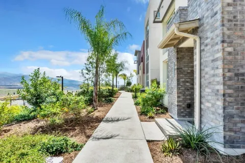a view of a pathway with house on both side