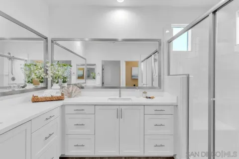 a bathroom with a sink and a mirror