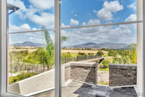 a view of a balcony with wooden floor