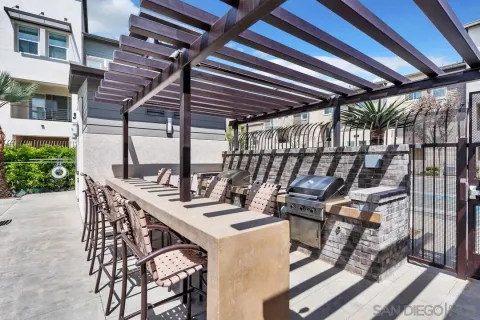 a view of a patio with a table and chairs