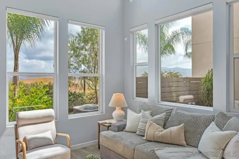 a living room with furniture and a large window