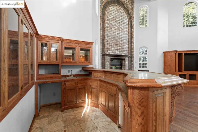 a kitchen with stainless steel appliances granite countertop a sink and cabinets