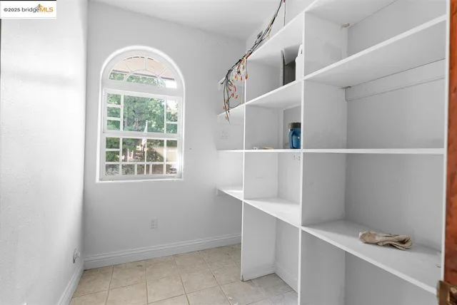 a bathroom with a sink and mirror with toilet