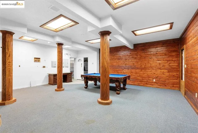 a view of an empty room with a fireplace