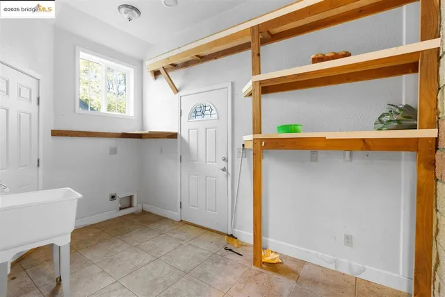 a kitchen with a sink and a window