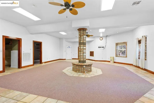 a view of a park with large trees