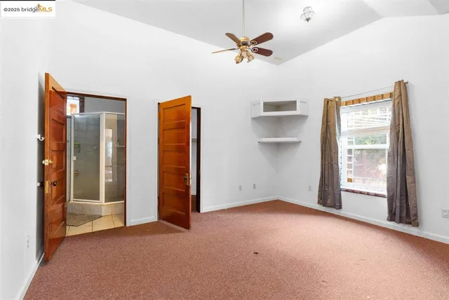 an aerial view of a house with mountain view