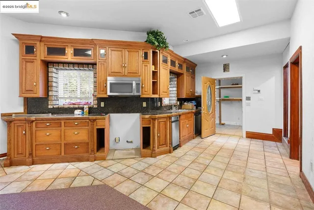 a view of a city with lush green forest