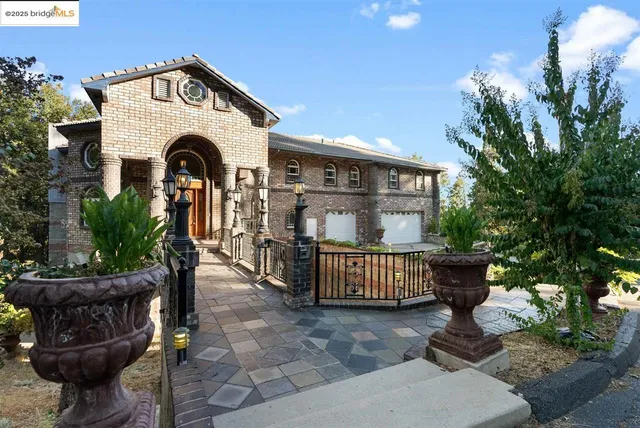 a front view of a house with garden