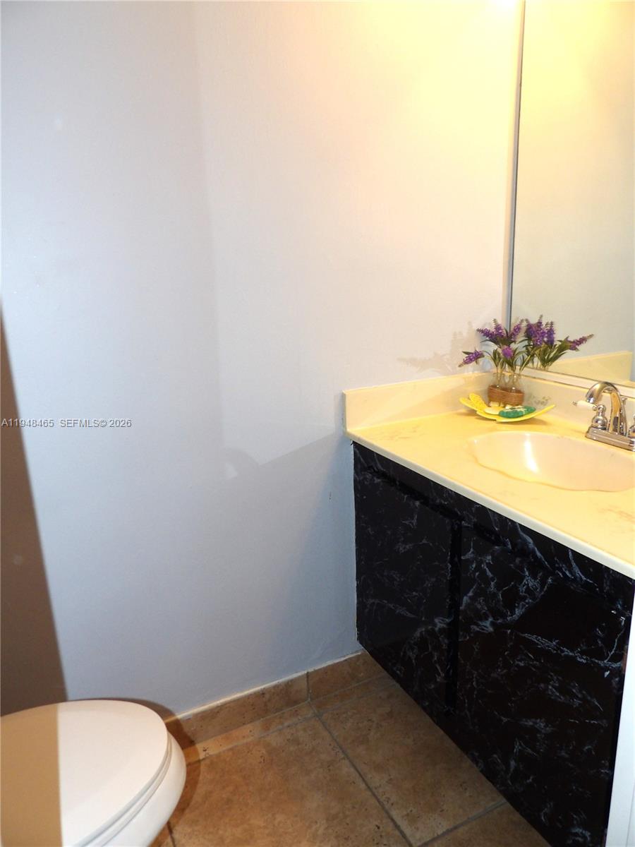 555 Northeast 15th Street, Unit 14E Miami, FL 33132 - Photo 9 of 26 a bathroom with a sink and a toilet