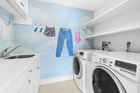 an aerial view of a house with a garden and trees