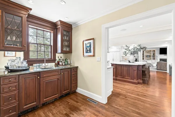 a large kitchen with a table and chairs