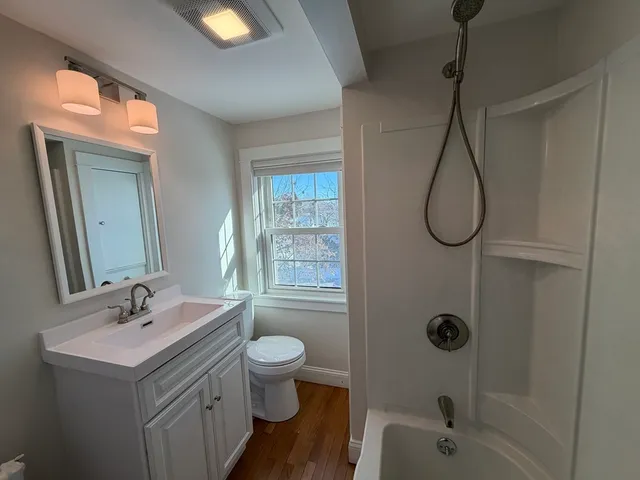 a bathroom with a sink a mirror and vanity