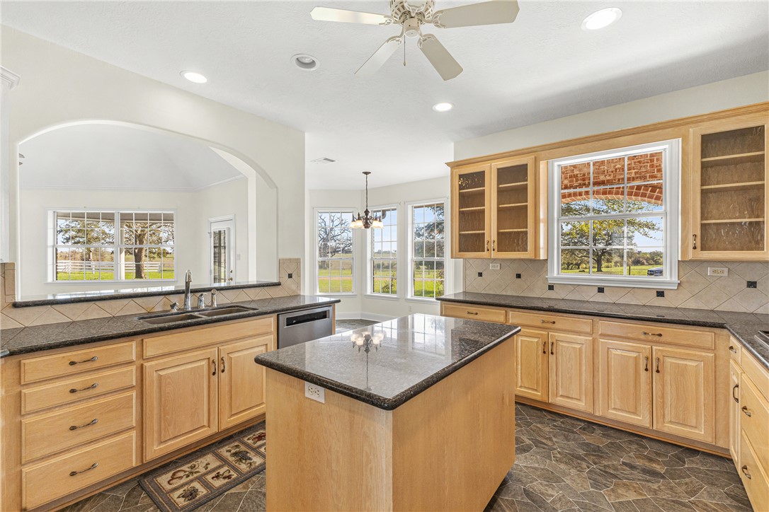 2120 Hohenwalde School Road Brenham, TX 77833 - Photo 12 of 30 a kitchen with granite countertop a sink and white cabinets