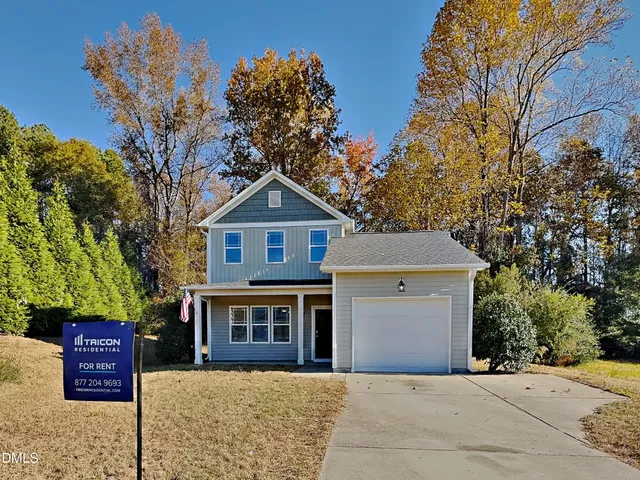 a front view of a house with yard