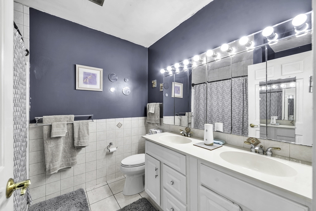 32 Stebbins Road Monson, MA 01057 - Photo 17 of 33 a bathroom with a double vanity sink mirror and toilet