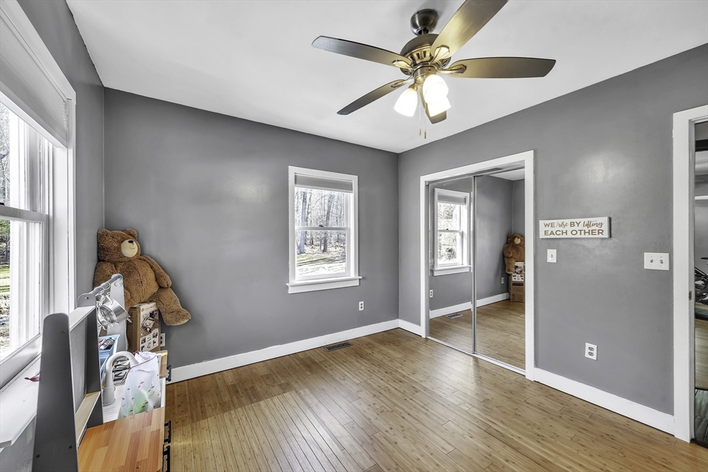 32 Stebbins Road Monson, MA 01057 - Photo 18 of 33 an empty room with wooden floor fan and windows