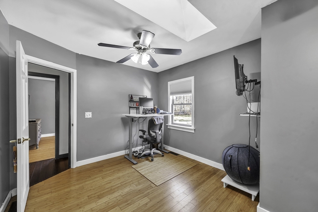32 Stebbins Road Monson, MA 01057 - Photo 20 of 33 a bedroom with a bed and a chandelier
