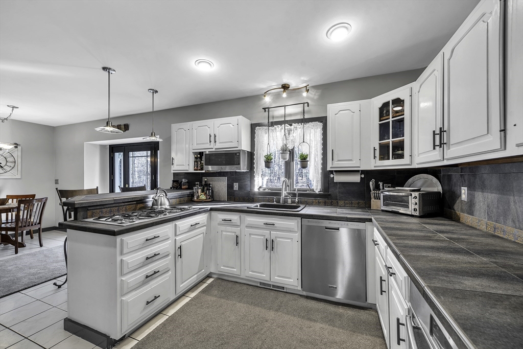 32 Stebbins Road Monson, MA 01057 - Photo 2 of 33 a kitchen with stainless steel appliances granite countertop a sink and cabinets