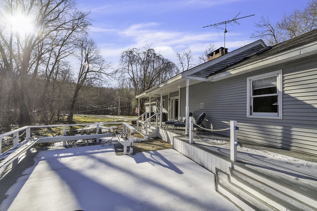 32 Stebbins Road Monson, MA 01057 - Photo 28 of 33 a view of a terrace with chairs and floor to ceiling window