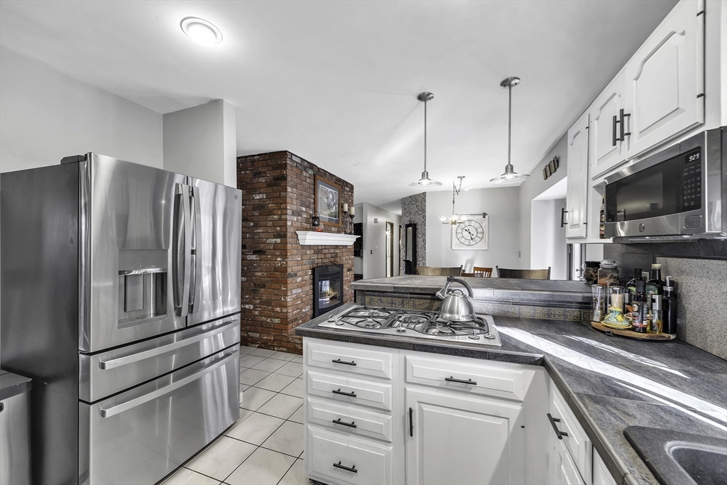 32 Stebbins Road Monson, MA 01057 - Photo 5 of 33 a kitchen with stainless steel appliances granite countertop a refrigerator a stove and a sink