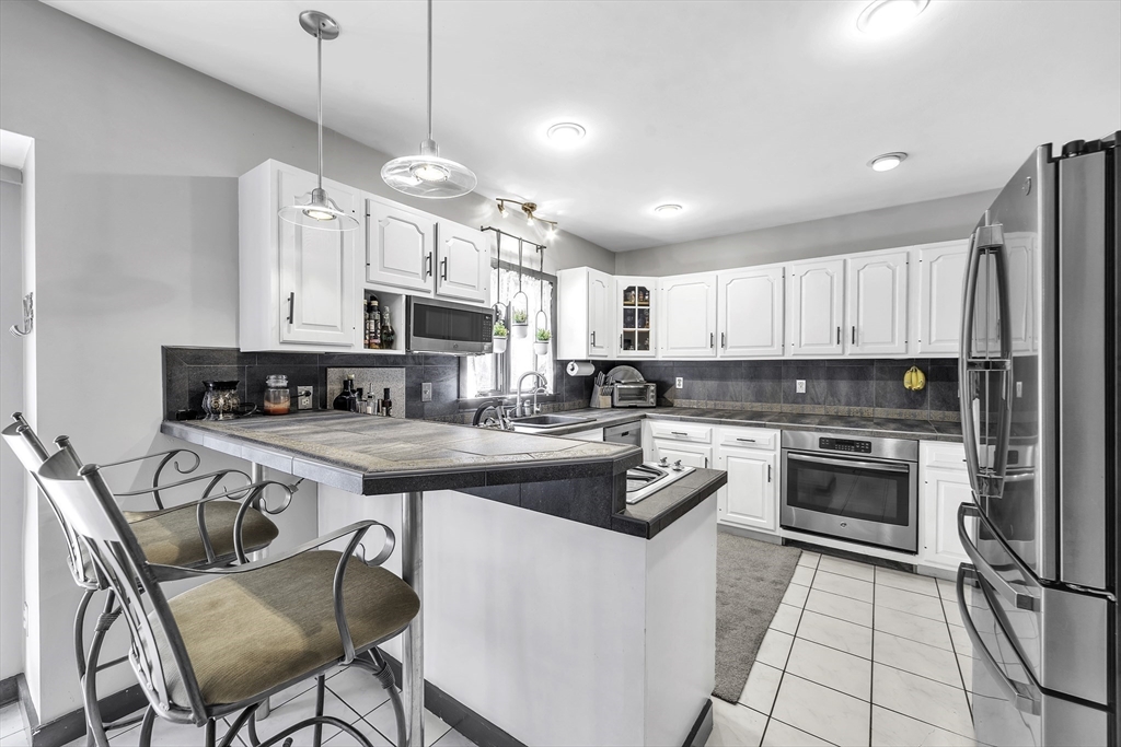32 Stebbins Road Monson, MA 01057 - Photo 6 of 33 a kitchen with cabinets a counter space a sink and appliances