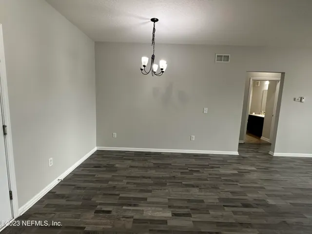 a view of a livingroom with wooden floor
