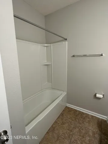 a bathroom with a bath tub