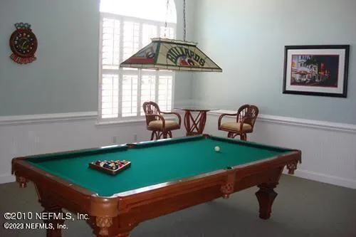 a living room with furniture a fireplace and flat screen tv