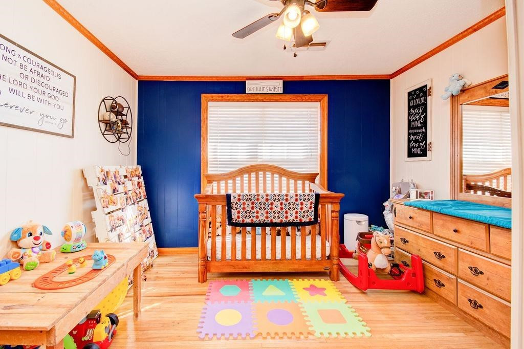 3298 Hawk Road Levelland, TX 79336 - Photo 19 of 32 a bedroom with a bed and a window