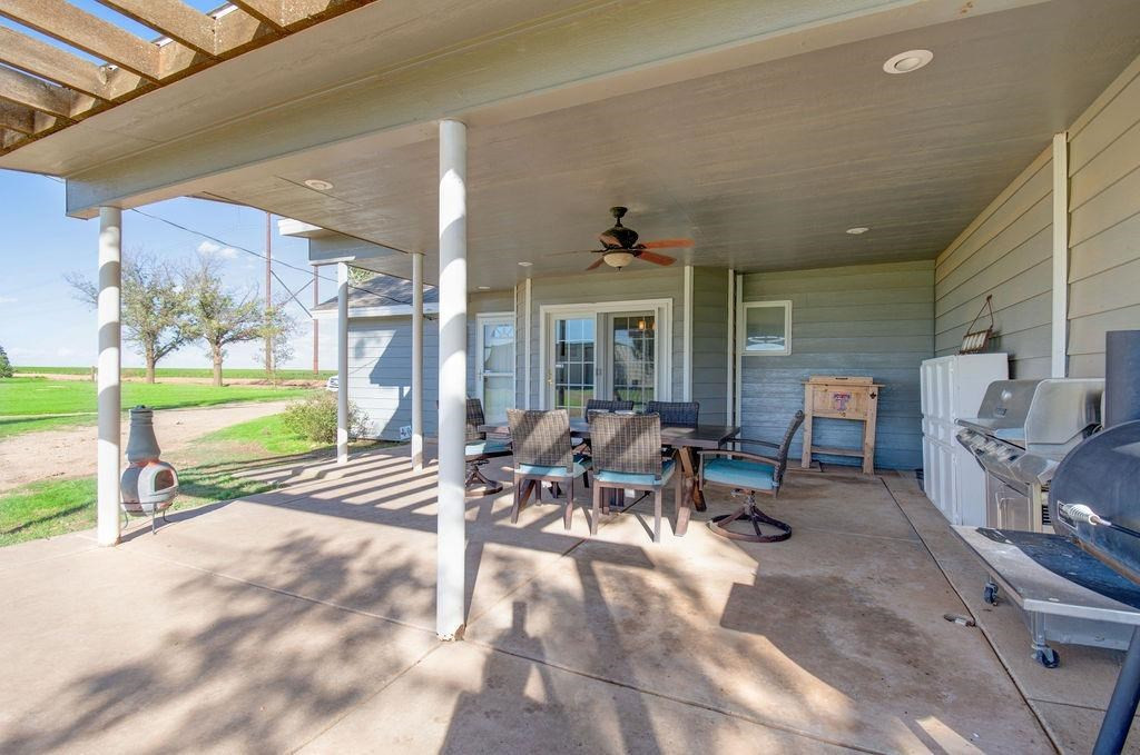 3298 Hawk Road Levelland, TX 79336 - Photo 26 of 32 a view of a chairs and table in a patio