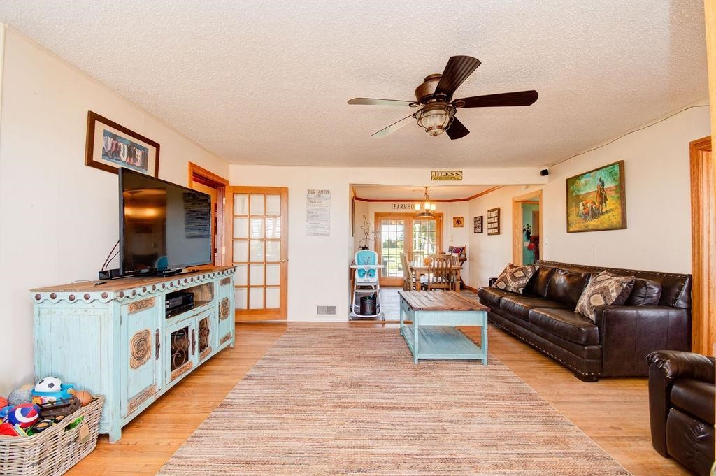 3298 Hawk Road Levelland, TX 79336 - Photo 5 of 32 a living room with furniture and a flat screen tv