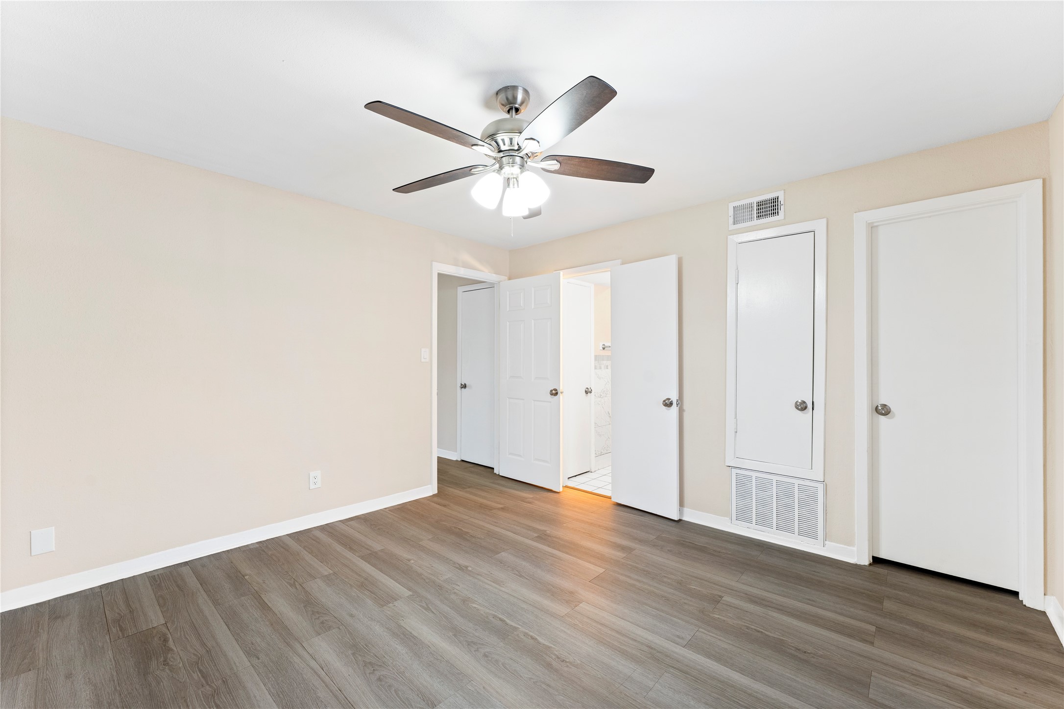 3316 Burke Road, Unit 43 Pasadena, TX 77504 - Photo 12 of 15 a view of an empty room with wooden floor