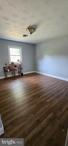a view of a livingroom with furniture nad window
