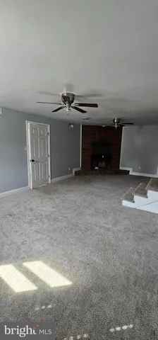 a view of a livingroom with furniture