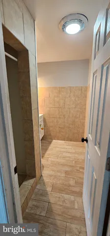 a bathroom with a bathtub and shower