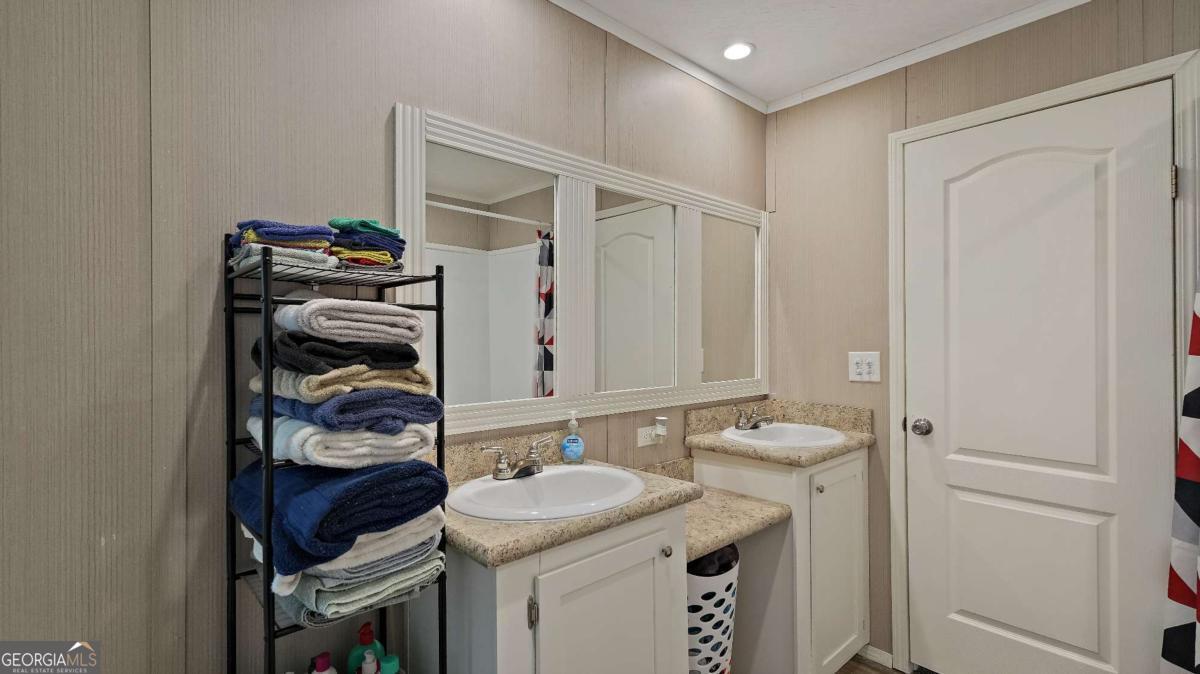 64 Sierra Road Jesup, GA 31545 - Photo 21 of 22 a bathroom with a sink and a mirror